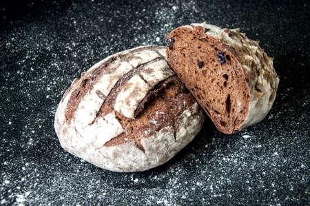 Freshly baked homemade artisan sourdough rye and white flour bread loafs. Close up. Copy space.の写真素材