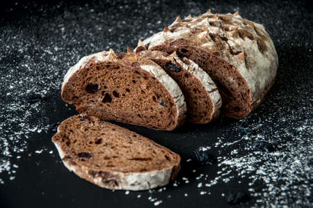 Freshly baked homemade artisan sourdough rye and white flour bread. Sliced. Top view. Close up. Copy space.の写真素材