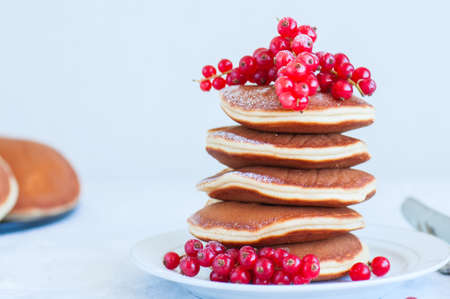 Close up of stack of homemade pancakes with bluberries in a white plate. Healthy food and breakfast concept. の写真素材