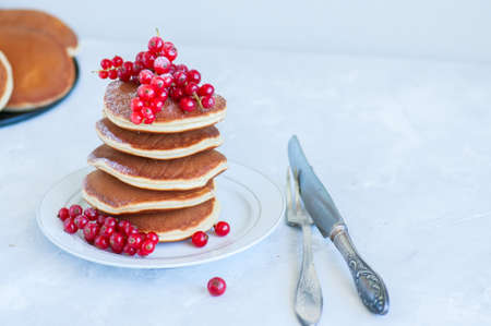 Close up of stack of homemade pancakes with bluberries in a white plate. Healthy food and breakfast concept. の写真素材