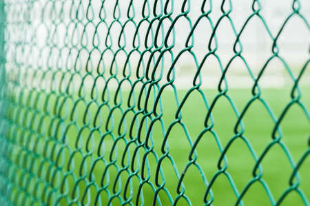 Green metal fence, abstract, toned.の写真素材