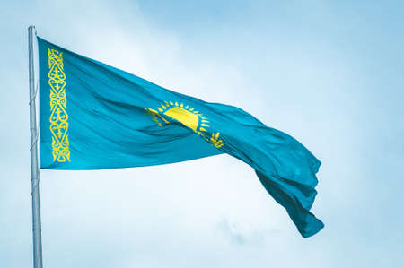 Blue flag of Kazakhstan waving on flagstaffの写真素材
