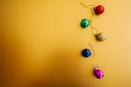 Red Gold Christmas Balls on golden background. Selective Focus. Copy Space. Top View.の写真素材