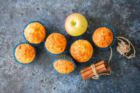 Homemade apple cheese muffins. Blue stone background. Seasonal baking. Top view.の写真素材