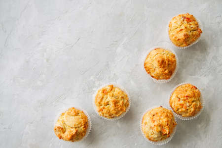 Homemade savory muffins with fish and cheese on a white stone background. Healthy snack or breakfast meal.の写真素材