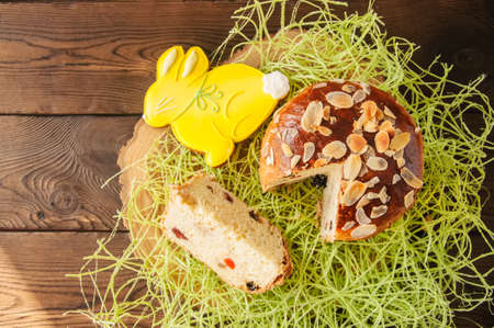 Easter orthodox sweet bread, slice of cottage cheese kulich and bunny  cookies.