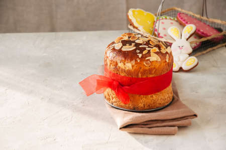 Easter orthodox sweet bread, cottage cheese kulich and colorful bunny and eggs cookies.の写真素材