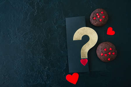 Chocolate cookies on a black stone backdrop. Saint Valentine's Day background.の写真素材