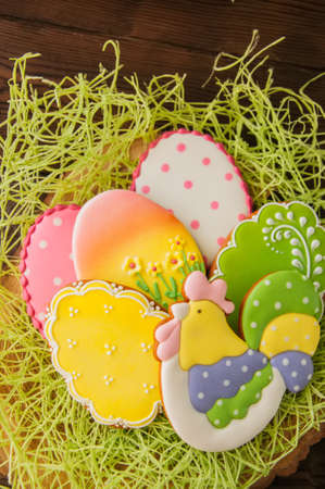 Colorful Easter egg cookies. Wooden background. Top view.の写真素材