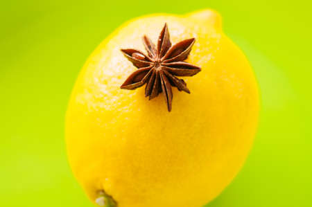 Close up of yellow lemon and anise star