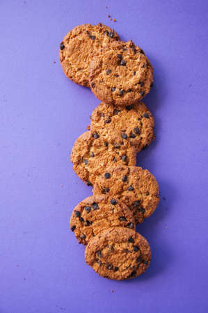 Traditional American homemade chocolate chips cookies on a purple background.の写真素材