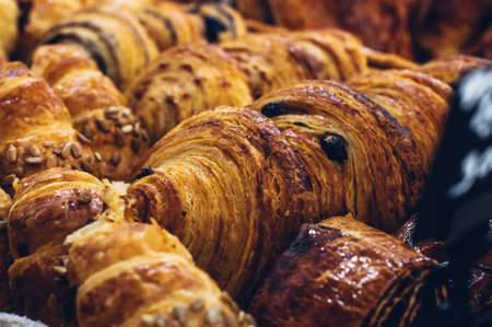 Freshly baked puff pastry in a counter. Close up and toned.の写真素材
