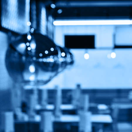 Blurred glass light bulbs in cafeteria backgroundの写真素材