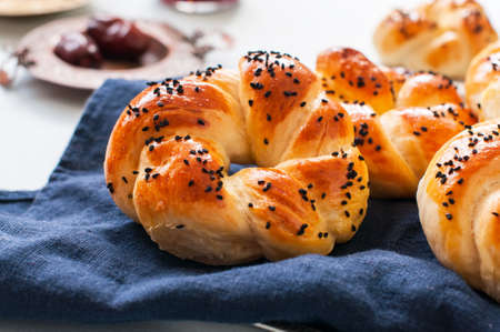 Homemade turkish bagel pogaca with nigella seeds. Freshly backed swirl buns.