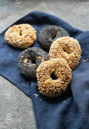 Freshly baked sesame and poppy seeded bagels. Close up.の写真素材