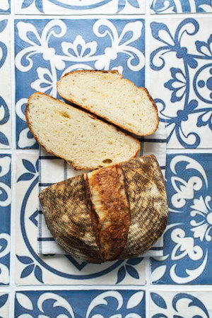 Freshly backed sliced cheesy sourdough bread. Top view.の写真素材