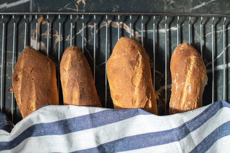 Freshly baked sourdough baguetts. Top view.の写真素材