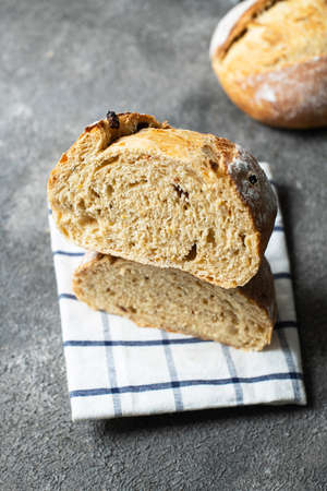 Freshly baked sourdough bread with dried tomatoes. Close up.の写真素材