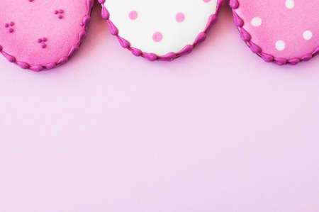 Easter background concept. Polka dot easter egg cookies on a pink background. top view. copyspace.の写真素材