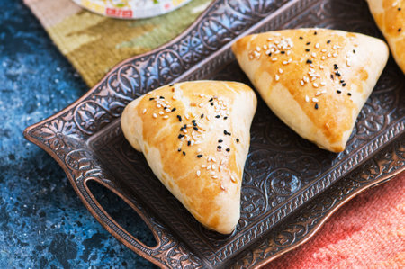 Samsa, national savory baking, usually with minced meat, cheese or vegetables as a filling, an...