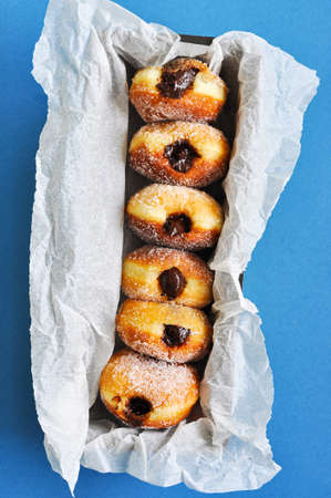 Homemade fried donuts with sugar and chocolate filling. close up.の写真素材