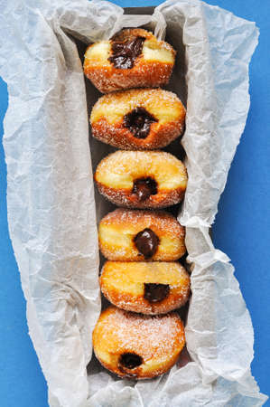 Homemade sugary donuts or berliners with chocolate filling.の写真素材
