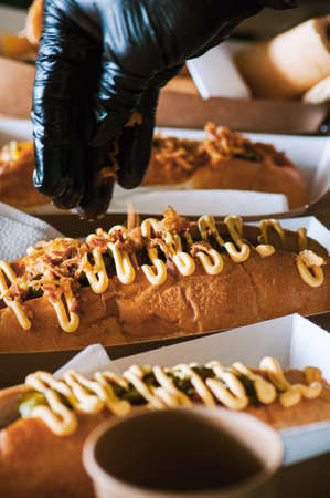 Freshly prepared hotdogs in a paper box. food delivery concept.