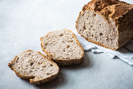 Close up of sliced bread on a gray background.の写真素材