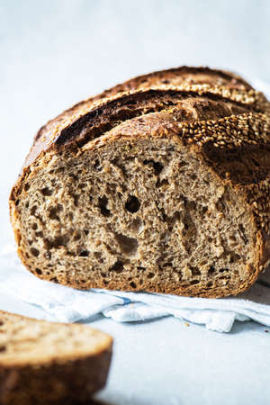 Close up of sliced rye bread on a gray background.の写真素材