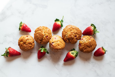 Strawberry muffins on a marble background. Top view.の写真素材
