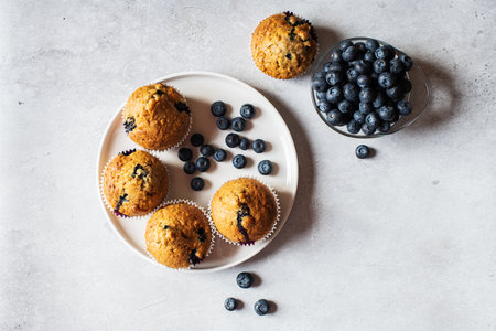 Blueberry muffins served in a plate on a marble background. Topview.の写真素材