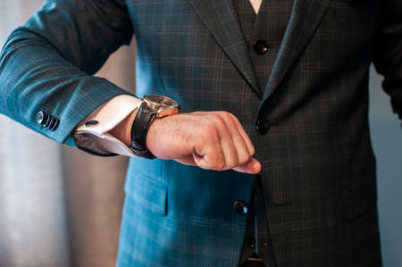 the groom puts a watch on his wristの写真素材