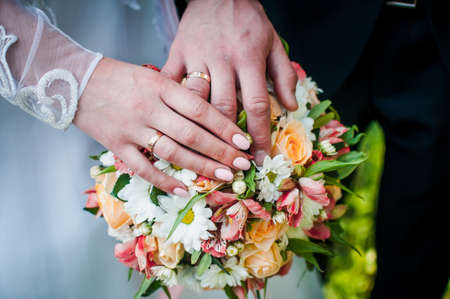 Colorful bouquet of flowers with hands on itの写真素材