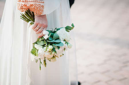 Bouquet of flowers in the hand of the brideの写真素材