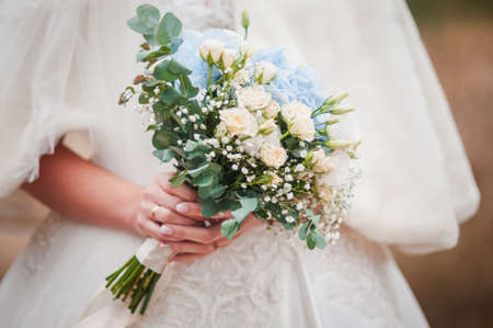 Bouquet of flowers in the hand of the brideの写真素材