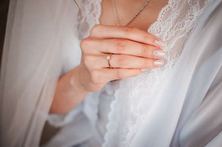 closeup girl straightens the peignoirの写真素材