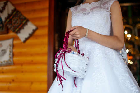 Bride is going to throwing candy from the basketの写真素材
