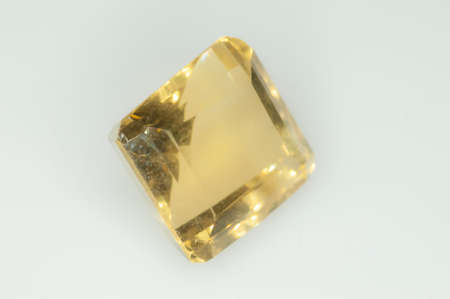 Natural yellow citrine on the white backgound