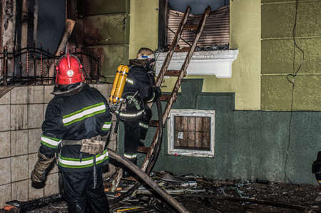 Ternopil, Ukraine - 18.02.2014 - Firefighters near central police department in fireのeditorial素材