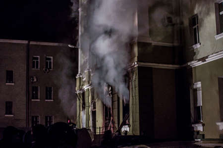 Ternopil, Ukraine - 18.02.2014 - dark smoke comes out of the windows of the police stationのeditorial素材