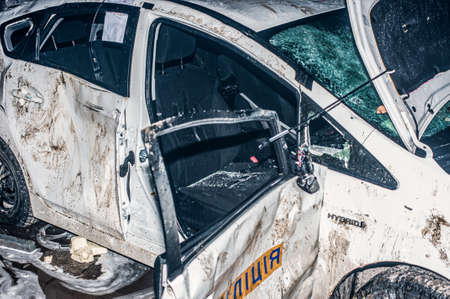 Ternopil, Ukraine - 18.02.2014 - Damaged police car near the burning police departmentのeditorial素材