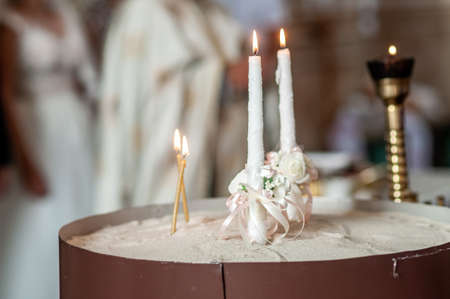 church lighted candles on the sandの写真素材
