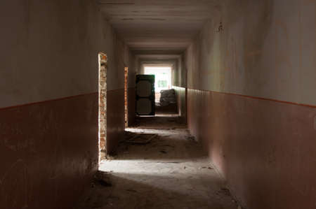 Abandoned rooms in the corridor of the abandoned office buildingの写真素材