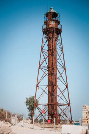 Old abandoned steel rusty lighthouse on the beach on the Dzharylgach islandの写真素材