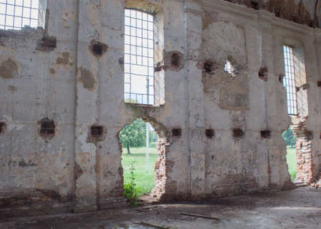 Wall with windows of ruined abandoned churchの写真素材