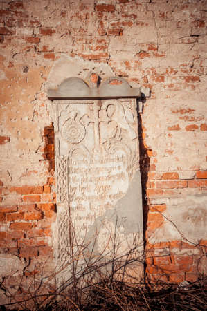 Stone with inscriptions near the abandoned churchの写真素材