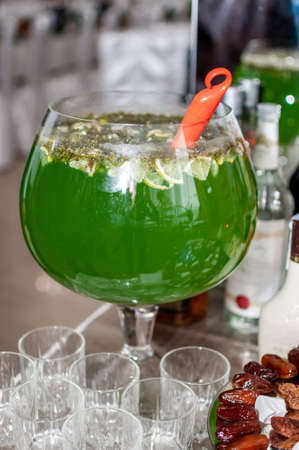 Wedding buffet. Green alcoholic cocktailの写真素材