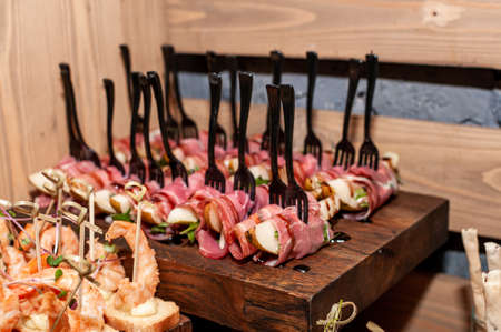 canape with ham, pear and soy sauceの写真素材