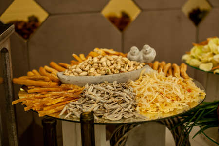 Buffet with different types of snacks and nutsの写真素材