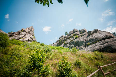 Remains of the rocks of the city of Tustan fortress in the Carpathian mountainsの写真素材